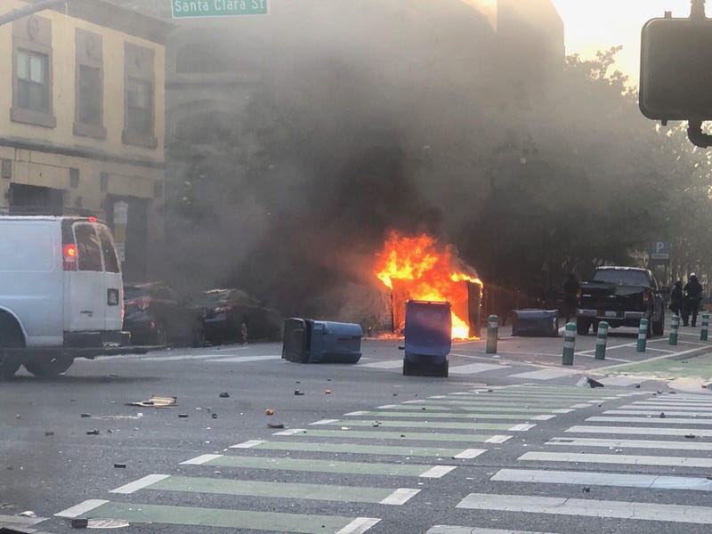 A dumpster burns at a George Floyd protest in San Jose.