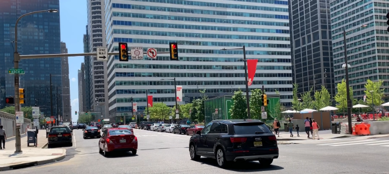 Cars running through a red light in Center City.