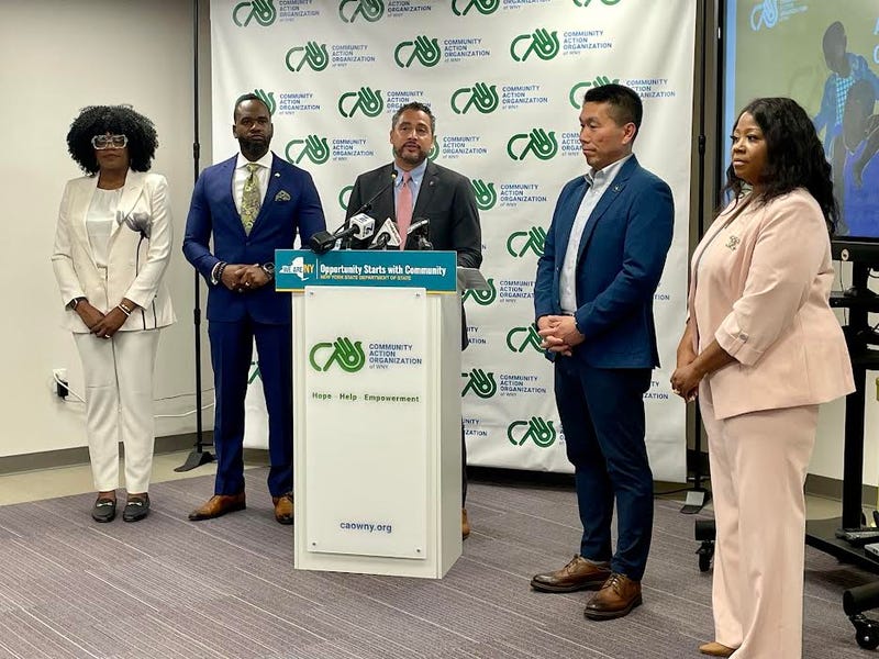 NY Secretary of State Robert Rodriguez stands with Buffalo Common Councilman Ulysees Wingo, President of CAO of WNY Thomas Kim and other leaders at the CAO of WNY in Buffalo, N.Y.