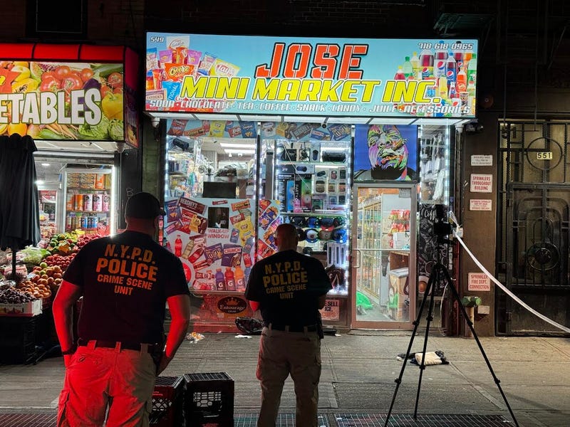 Police outside the bodega on Thursday night