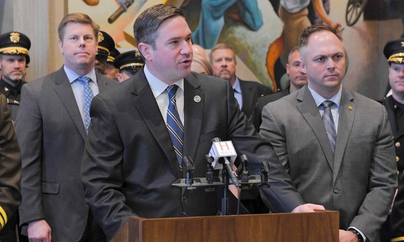 Attorney General Andrew Bailey speaks during a 2024 news conference in the Missouri House Lounge, flanked by House Speaker Dean Plocher, left, and state Rep. Justin Sparks.