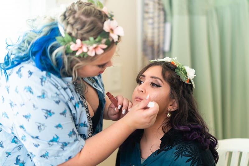 Maid of Honor, Mara, helps Alanna with her makeup