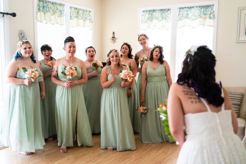Alanna's wedding party does a first look in her dress