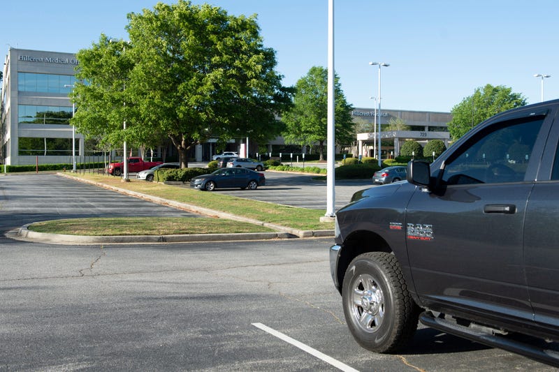 Greenville County Sheriff Hobart Lewis bows his head during 20 minutes of prayer in the parking lot at Hillcrest Hospital in Simpsonville Thursday, April 9, 2020. Ss Prayer 04 09 2020 2856