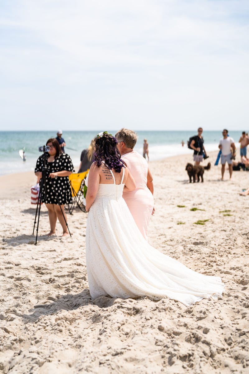 Alanna's mom, Brenda, walks her down the aisle