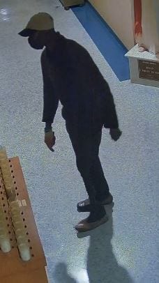 Nassau County Police released on Thursday surveillance images of a burglar who robbed the donation box of a Long Island Catholic church after breaking and entering, in hopes that someone recognizes him.