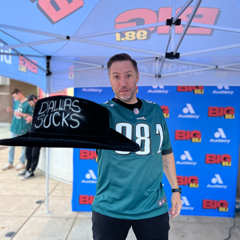 Trey Morgan with BIG 98.1's Dallas Sucks hat before the Eagles vs. Cowboys game