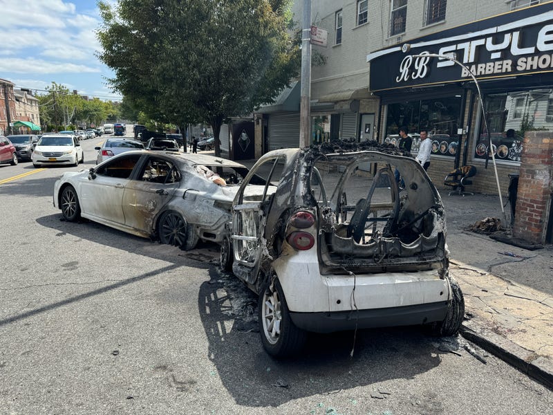 Several vehicles are seen torched on Tuesday afternoon as the fire marshal investigated