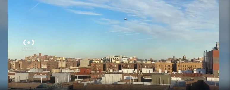 A helicopter in the distances searches for suspects for the stabbing of a teen in Sunnyside, Queens, on Feb. 14, 2025.