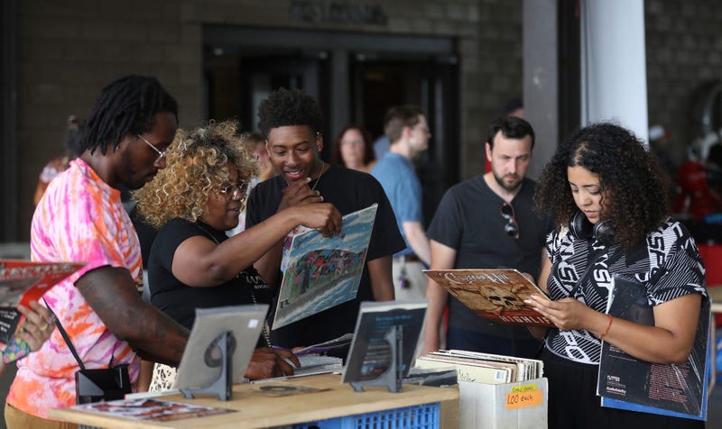 People shopped for everything from books to old vinyl, political pins and journals during the Detroit Book Fest at Eastern Market.