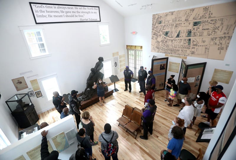 Visitors tour the Harriet Tubman Museum of New Jersey.