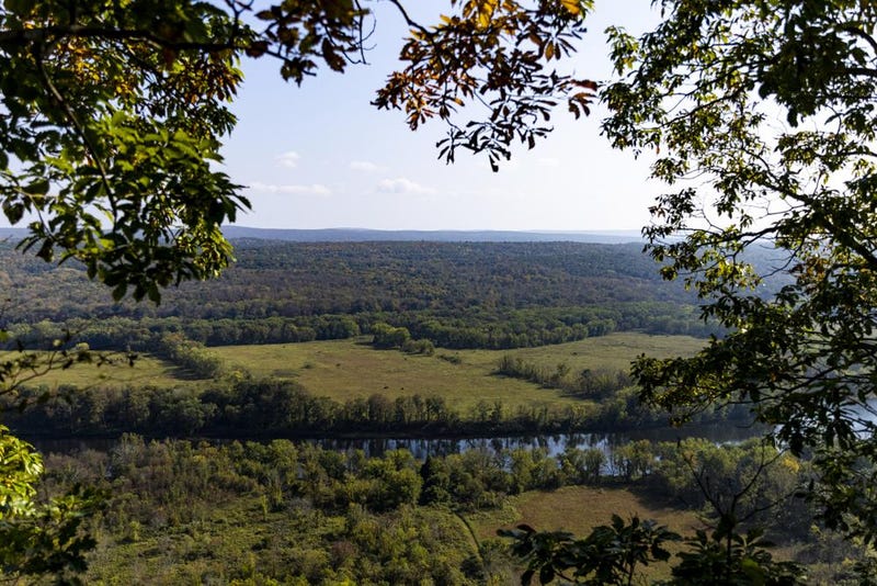 A view of the Delaware River and New Jersey from a cliffside at the Delaware Water Gap as fall foliage approaches in Milford, Pa., on Friday, Oct. 15, 2021. “You never hear people say, ‘I’m going to go see all the national recreation areas in America,’” said John Donahue, who spent 14 years as park superintendent of the Delaware Water Gap. “This place, basically, already is a national park.”