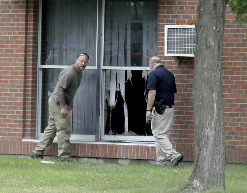 FILE - In this Saturday, Aug. 5, 2017 file photo, law enforcement officials investigate an explosion at the Dar Al-Farooq Islamic Center in Bloomington, Minn. The leader of an Illinois anti-government militia group who authorities say masterminded the 2017 bombing of a Minnesota mosque is to be sentenced Monday, Sept. 13, 2021, for several civil rights and hate crimes in an attack that terrified a community.