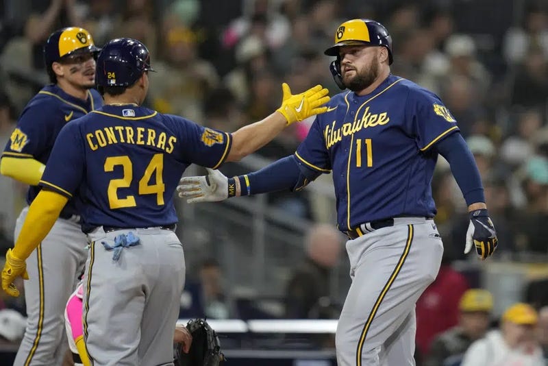 Milwaukee Brewers' Rowdy Tellez (11) celebrates with teammates William Contreras (24) and Willy Adames after hitting a three-run home run during the sixth inning of a game against the San Diego Padres, Friday, April 14, 2023, in San Diego