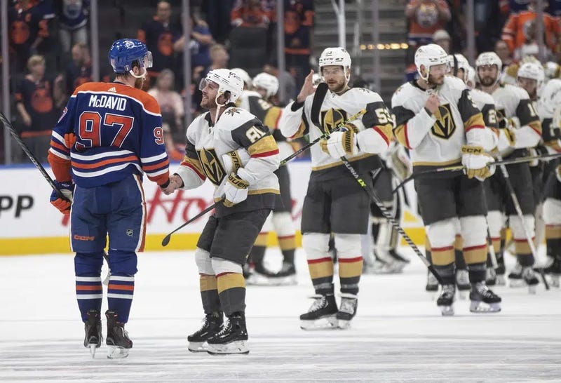 Vegas Golden Knights' Jonathan Marchessault (81) and Edmonton Oilers' Connor McDavid (97) shake hands after Game 6 of an NHL Stanley Cup second-round playoff hockey series in Edmonton, Alberta