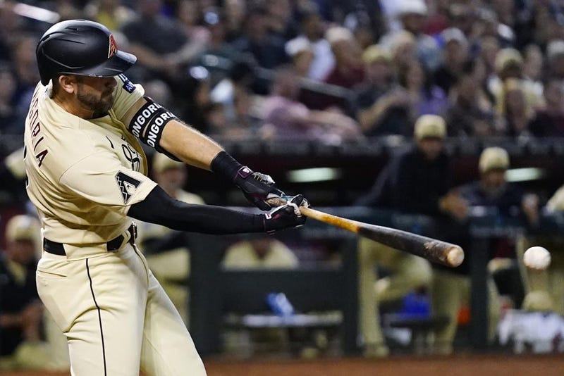 Arizona Diamondbacks' Evan Longoria hits a double against the Los Angeles Dodgers during the eighth inning of a baseball game Friday, April 7, 2023, in Phoenix.