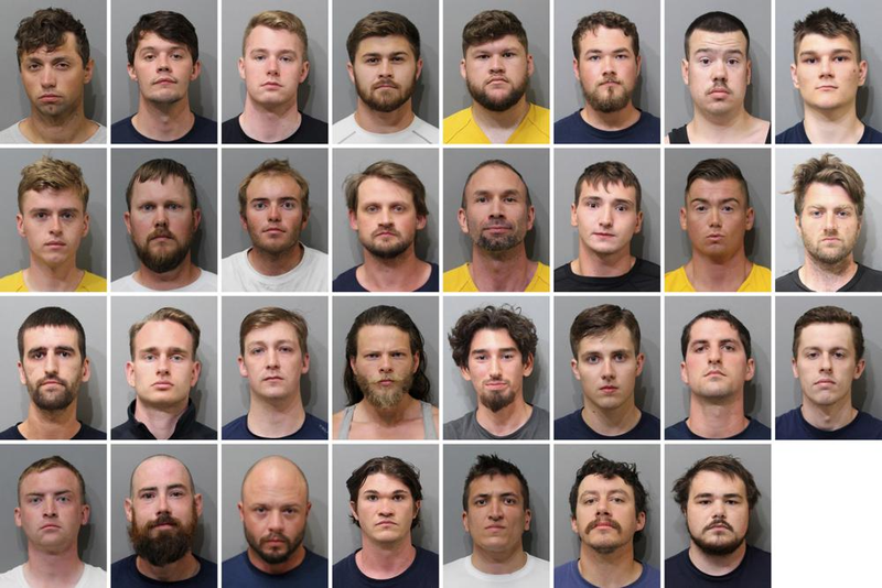 These booking images provided by the Kootenai County Sheriff’s Office show the 31 members of the white supremacist group Patriot Front who were arrested after they were found packed into the back of a U-Haul truck with riot gear near an LGBTQ pride event in Coeur d’Alene, Idaho, on Saturday, June 11, 2022.