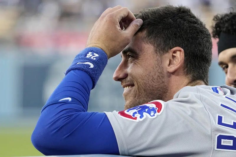 Chicago Cubs center fielder and former Los Angeles Dodger Cody Bellinger smiles from the dugout after being acknowledged by the Dodgers prior to a game Friday, April 14, 2023, in Los Angeles