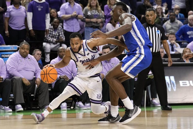 Kansas State guard Markquis Nowell (1) works against Kentucky forward Oscar Tshiebwe (34) during the first half of a second-round college basketball game in the NCAA Tournament on Sunday, March 19, 2023, in Greensboro, N.C.