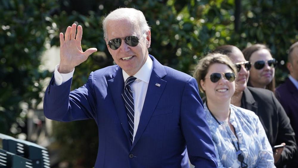 Biden kicks off midterm rally as Democrats see opening