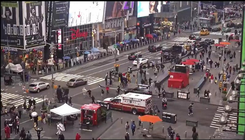 In this image taken from video by the FDNY, pedestrians hurry away from the scene of a shooting in Times Square, Saturday, May 8, 2021, in New York. New York City police say three innocent bystanders including a 4-year-old girl who was toy shopping have been shot in Times Square and officers are looking for suspects. All the victims are expected to recover. 