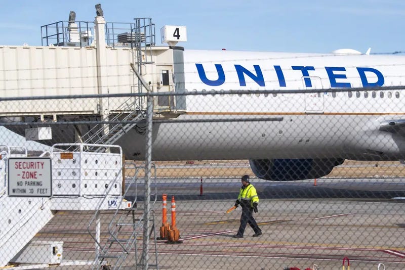 Members of the ground crew secure the site after a United airlines flight made an emergency landing at the Lincoln airport on Saturday, Feb. 4, 2023. The flight headed from Chicago to Las Vegas made an unplanned stop in Nebraska on Saturday after the pilot reported engine problems