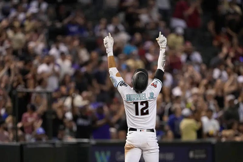 Arizona Diamondbacks' Lourdes Gurriel Jr. celebrates his RBI triple against the Los Angeles Dodgers during the third inning of a baseball game, Saturday, April 8, 2023, in Phoenix. 