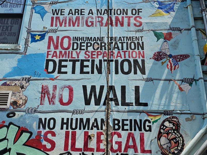 A mural in Chicago's Pilsen neighborhood advocates for the immigrant experience.