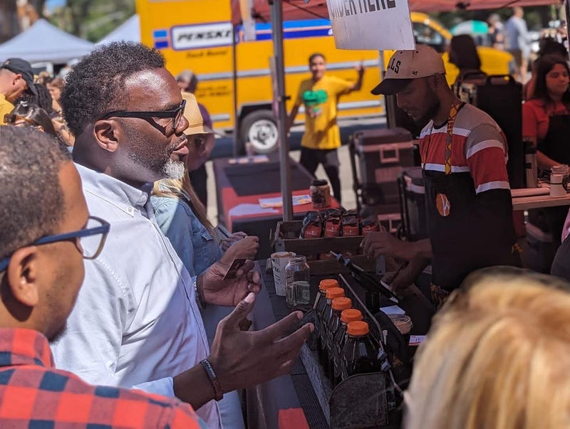 Chicago Mayor Brandon Johnson stops by the Kikwetu Coffee Company booth at the Logan Square Farmers Market August, 2023.