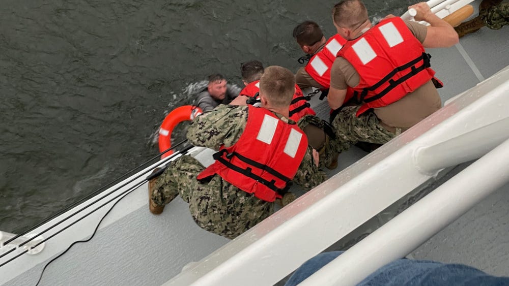 6 people rescued from capsized boat, 1 dead, 12 still missing says Coast Guard