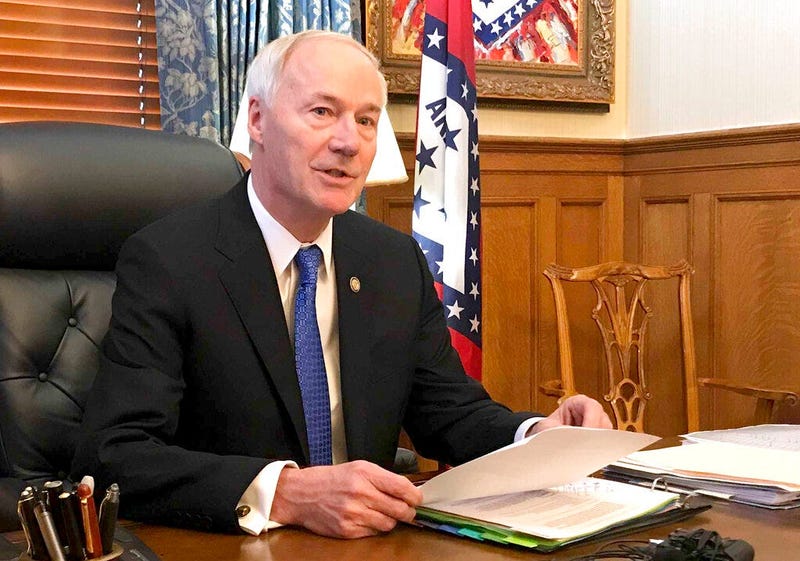 Arkansas Gov. Asa Hutchinson speaks to reporters in his office at the state Capitol in Little Rock, Ark., Wednesday, April 10, 2019, about a bill prohibiting "sanctuary cities" that don't cooperate with federal immigration authorities. The governor said W
