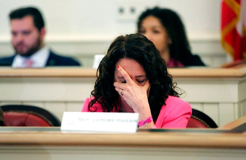 Ohio Representative Michele Lepore-Hagan wipes tears from her face during a hearing to propose amendments to the "Heartbeat Bill" which was later voted to pass through the committee and to the House floor at the Ohio Statehouse in Columbus, Ohio on Tuesda