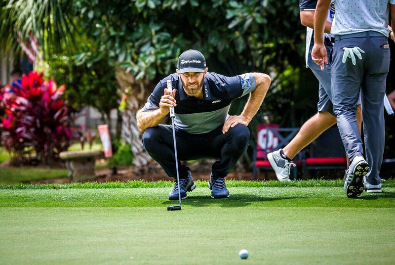 Dustin Johnson eyes his birdie putt on the 8th green during the second round of the RBC Heritage golf tournament in Hilton Head Island, S.C., Friday, April 19, 2019. 