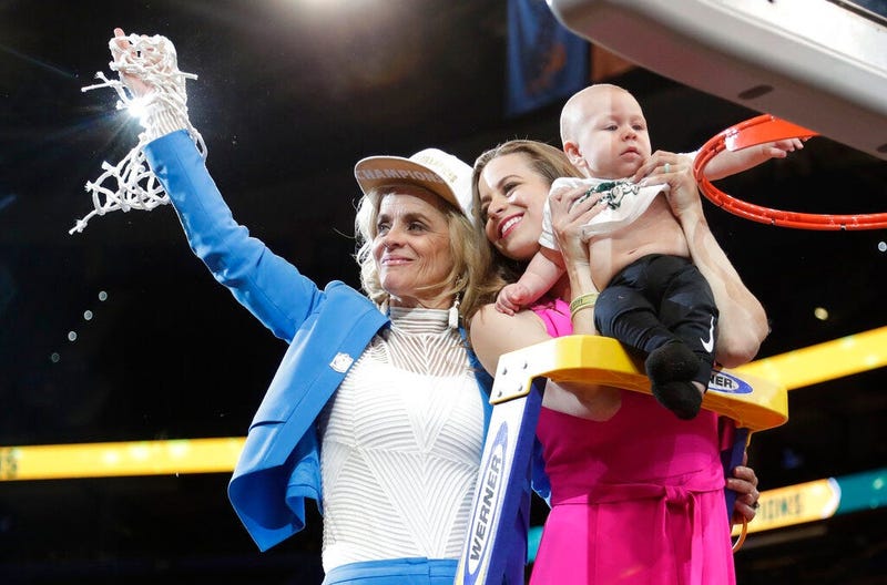 aylor coach Kim Mulkey, left, waves the net while standing with daughter and assistant coach Makenzie Fuller and Fuller's son, Kannon Reid Fuller, after the Final Four championship game of the NCAA women's college basketball tournament