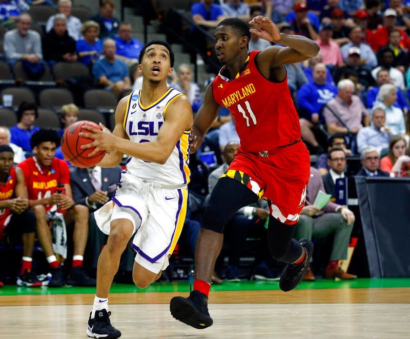 LSU's Tremont Waters, left, goes to the basket past Maryland's Darryl Morsell (11) during the first half of a second-round game in the NCAA men’s college basketball tournament in Jacksonville, Fla., Saturday, March 23, 2019