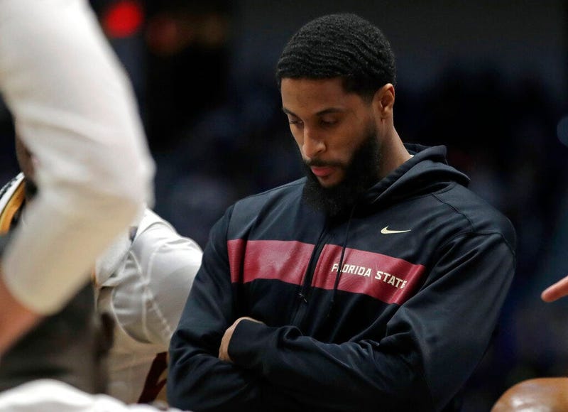 Florida State's Phil Cofer watches during a team huddle in the second half of a second round men's college basketball game against Murray State in the NCAA Tournament, Saturday, March 23, 2019, in Hartford, Conn. Florida State won 90-62