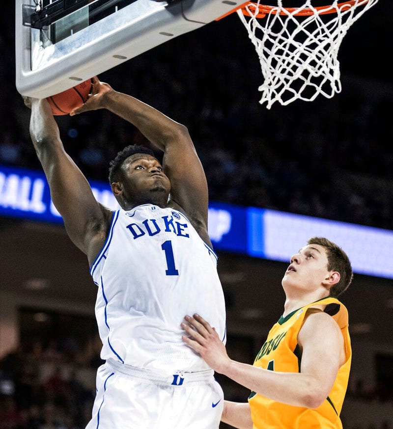 Duke forward Zion Williamson (1) goes up for a dunk against North Dakota State forward Rocky Kreuser (34) during the first half of a first-round game in the NCAA men’s college basketball tournament Friday, March 22, 2019, in Columbia, S.C