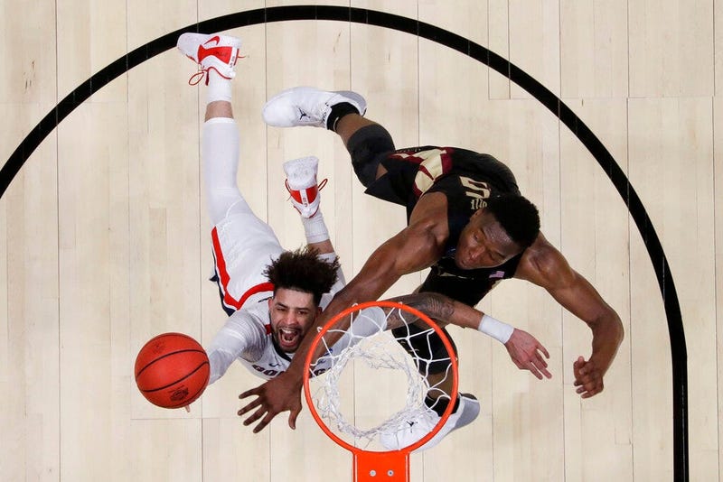 Gonzaga guard Josh Perkins, left, drives to the basket past Florida State forward Mfiondu Kabengele during the first half an NCAA men's college basketball tournament West Region semifinal Thursday, March 28, 2019, in Anaheim, Calif