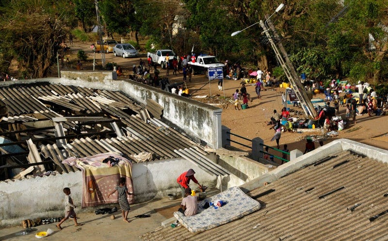 Displaced families set up their bedding on top of the roof in Buzi district, 200 kilometers (120 miles) outside Beira, Mozambique