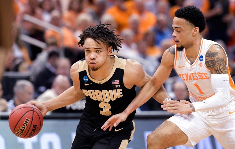 Purdue's Carsen Edwards (3) is defended by Tennessee's Lamonte Turner (1) during the second half of a men's NCAA Tournament college basketball South Regional semifinal game Thursday, March 28, 2019, in Louisville, Ky.