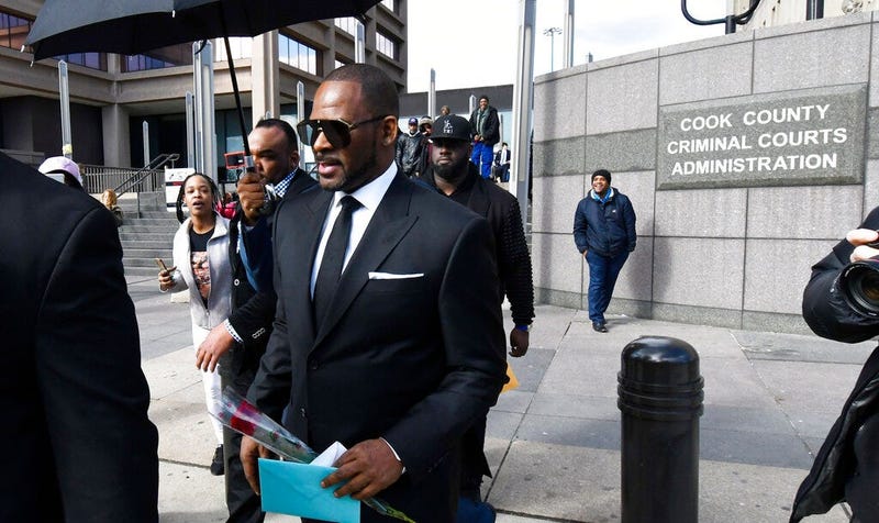 R. Kelly, front, leaves the Leighton Criminal Court after a hearing on Friday, March 22, 2019, in Chicago.