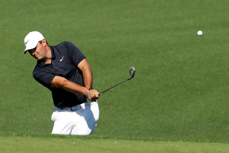 Patrick Reed hits a chip shot on the second hole during a practice round for the Masters golf tournament Wednesday, April 10, 2019, in Augusta, Ga.