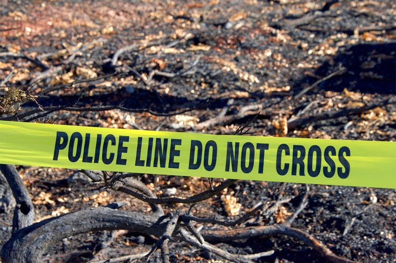 OCTOBER 22ND, 2017 - Yellow tape POLICE LINE DO NOT CROSS in front of burned out structure debri flattened to the ground in the wild fire that raged through Napa County. (Photo credit: Sheila Fitzgerald)