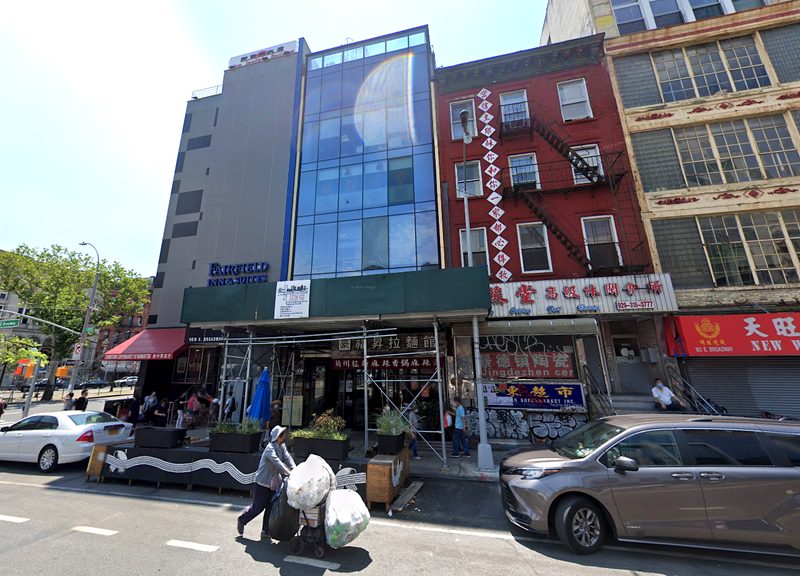 The glass building is where federal officials the men allegedly operated out of 107 East Broadway.
