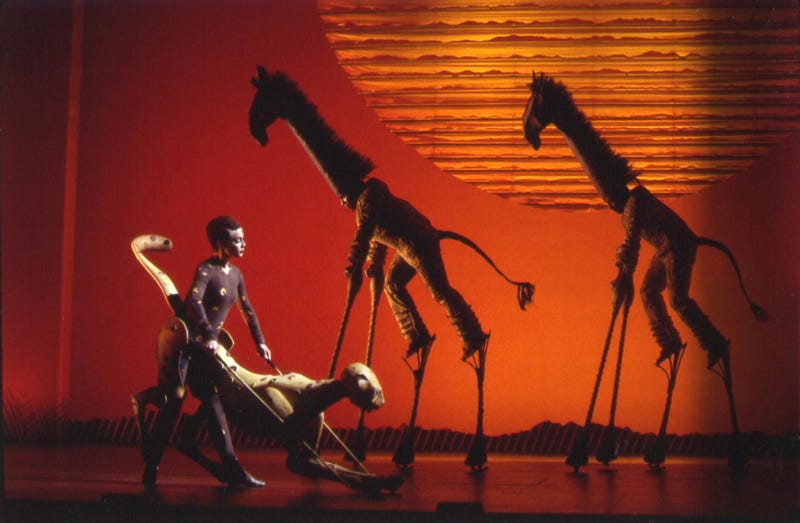 Performers using puppets in "The Lion King" musical