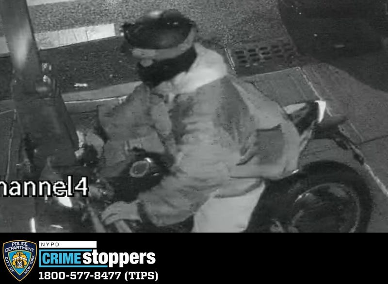 A surveillance image released by police on Wednesday shows the suspect on his motorbike