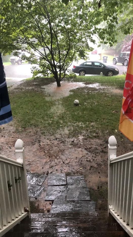 Rain in a flooded yard in Midlothian in 2020.