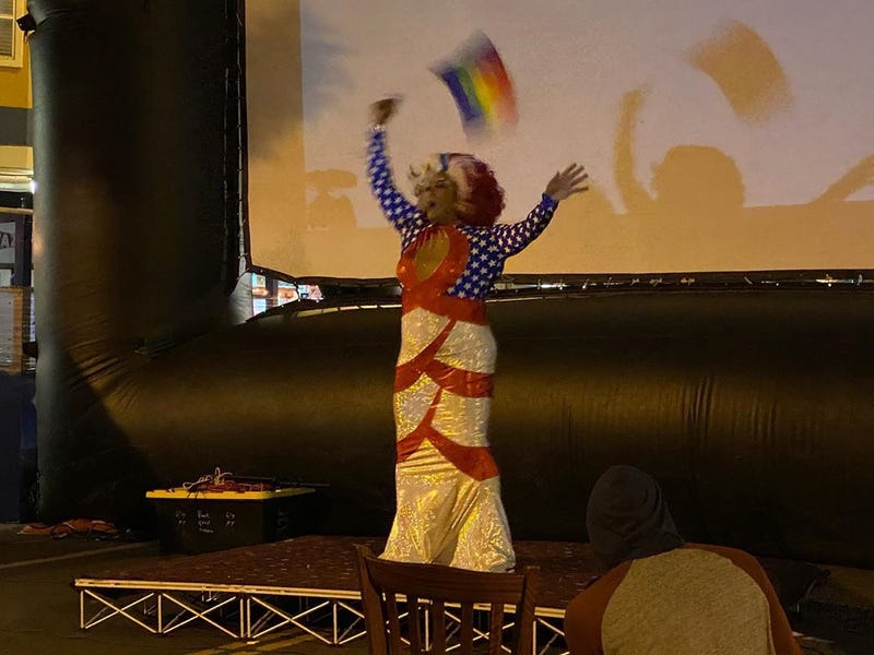 A drag performer takes the stage during an election night watch party in San Francisco.