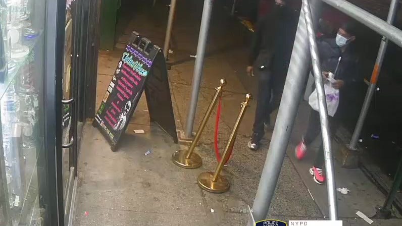 VIDEO: Armed robbers steal $3K from Manhattan store, 2 sought