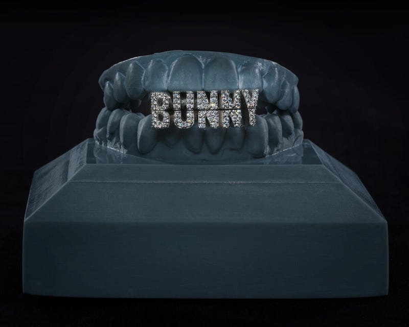 Designed for Bad Bunny by ALLIGATOR JESUS (David Tamargo) in 2023, this grill set features 14-karat white gold with sparkling diamonds and rhodium plating.